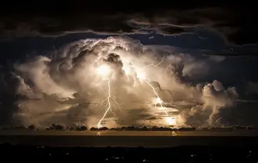 What Causes Thunderstorms? Thunderstorm with lightning and dark clouds